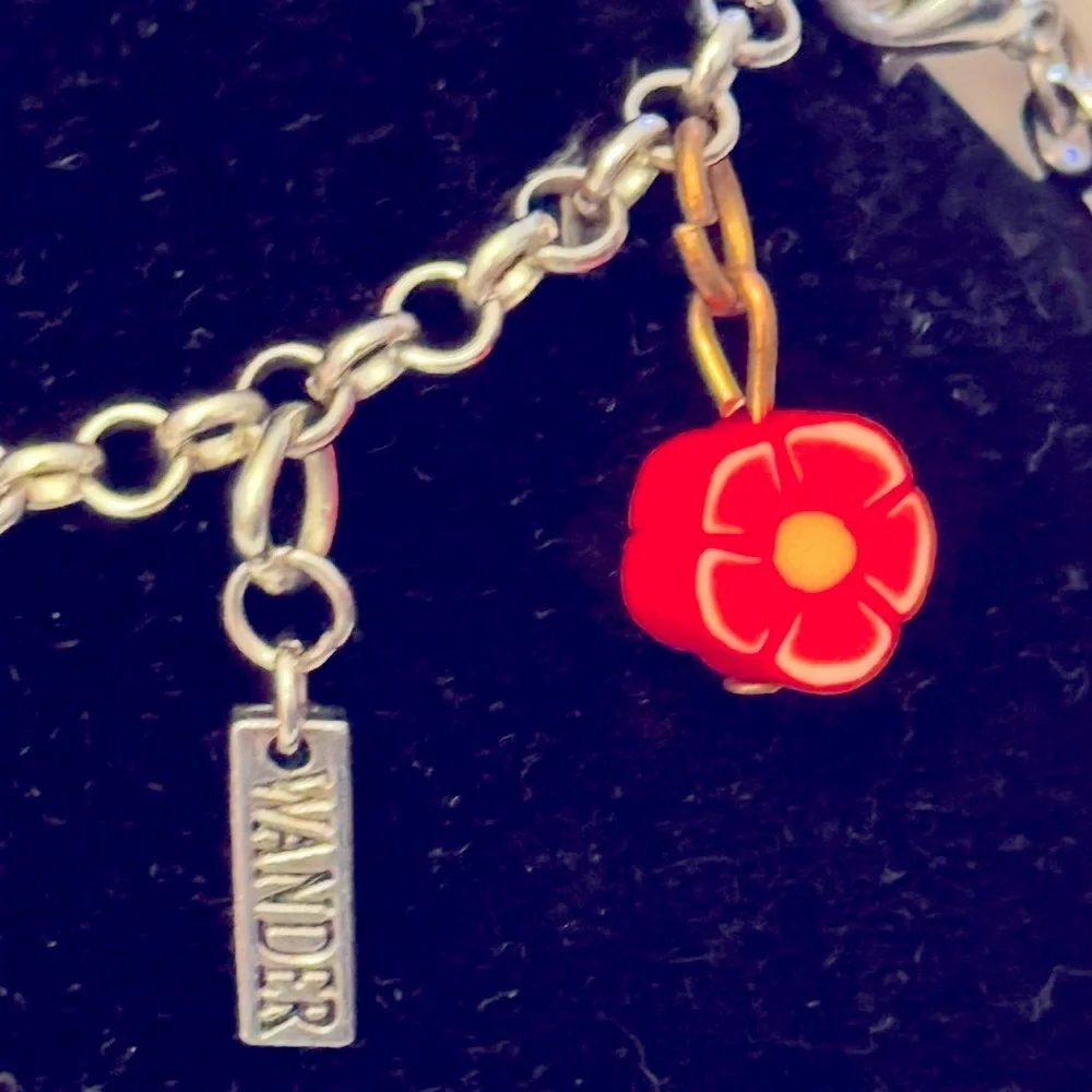 Wander Silver Tone Charm Bracelet